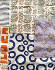 Collection of various patterned fabric swatches arranged in a patchwork style.