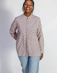 Model wearing linen top with small flower print.
