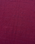 Close up display of burgundy linen dress, fabric.
