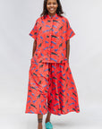 Model wearing red cat print shirt and culotte.