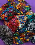 Display image of reversible, patchwork bucket hats.
