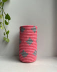 Display of hot pink and dirty blue vase