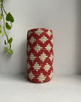 Display of red and beige colored vase