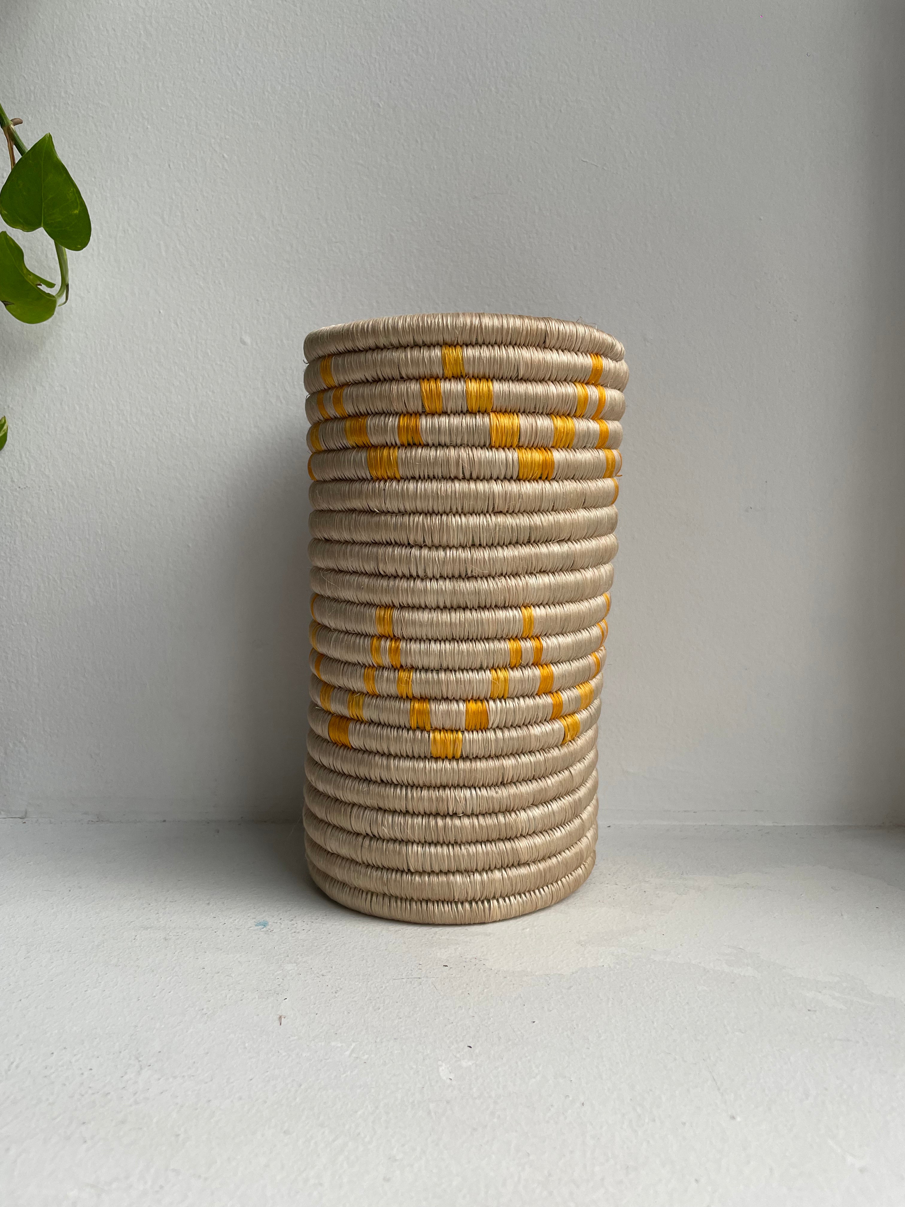 Display of orange triangle striped vase