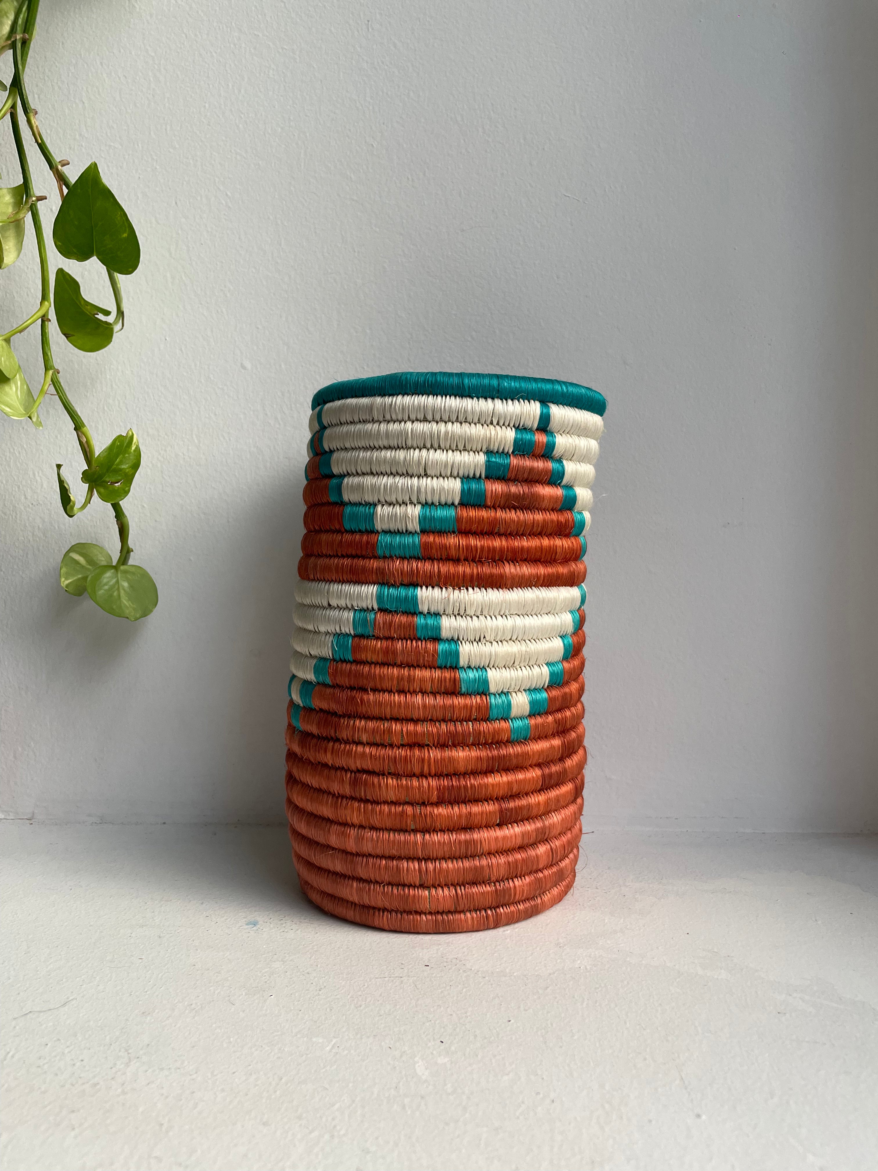 Display of brown, white and aqua triangle vase