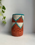 Display of brown, white and aqua triangle vase