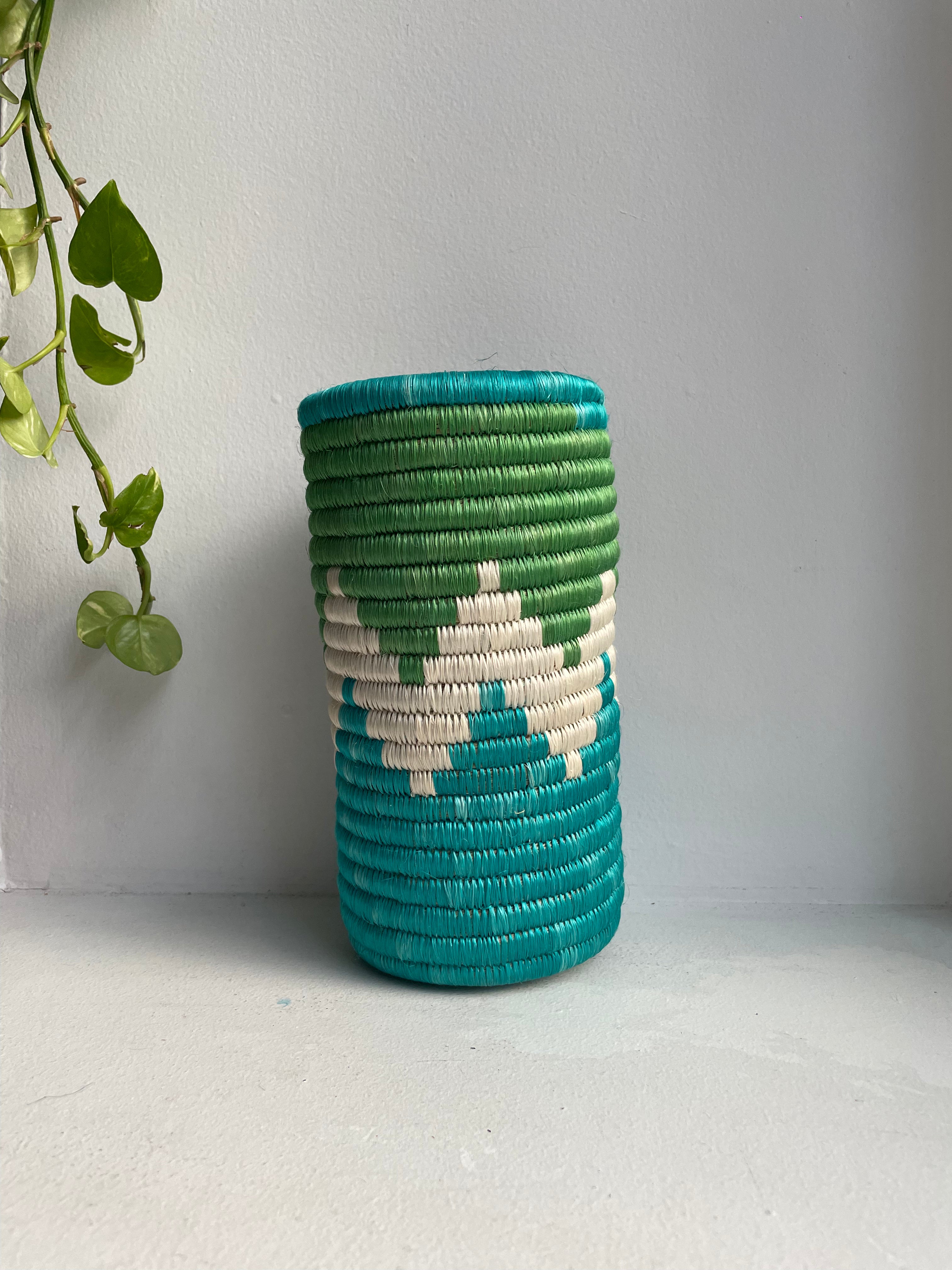 display of aqua blue, white and green vase