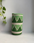 Display of white, green and pastel green triangle vase