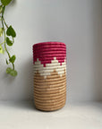 Display of red, white and beige colored vase