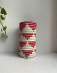 Display of rose pink and white triangle vase