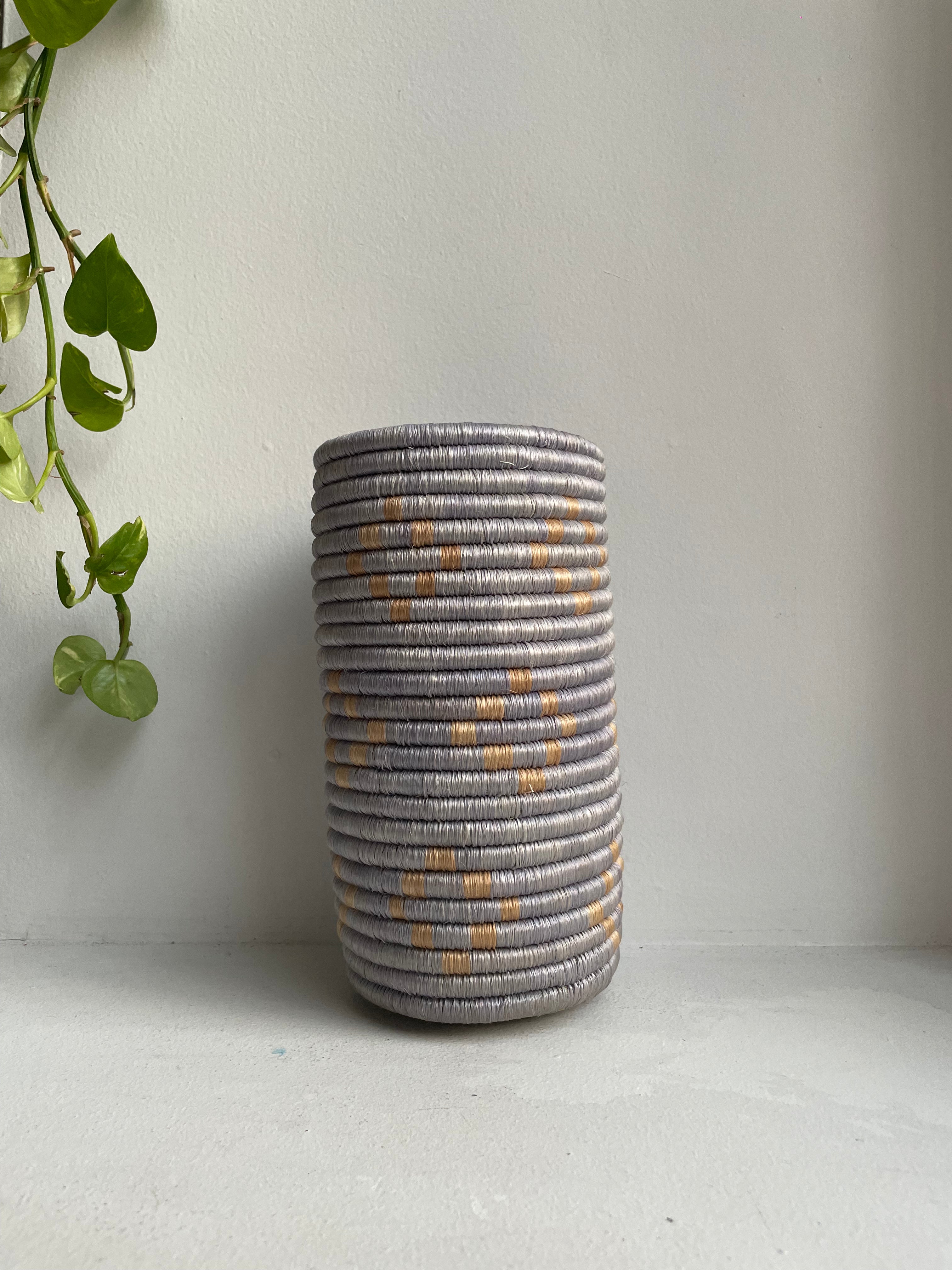 Display of beige and dusty blue vase with geometric design