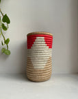 Display of red, white and beige colored vase