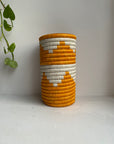 Display of white and turmeric vase