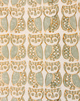 Close up display of long sleeved shirt with small owl print, fabric.