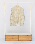 Display of long sleeved shirt with small owl print.