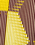 Close up display of Yellow, Maroon Brown, Mustard Green and Pale Yellow abstract print shirt, fabric.