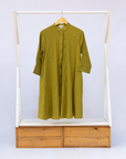 Display of olive green linen dress.