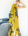 A person holding a peace silk scarf with a floral pattern, displayed in a light-colored fabric.