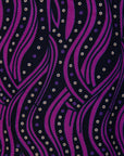 Close up display of purple and black abstract print sleeveless shirt, fabric.