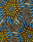 Close up display of blue, yellow, orange and black geometric print dress, fabric.