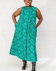 Model wearing teal floral maxi dress.
