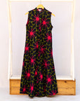 Display of navy and green dress with pink floral print.