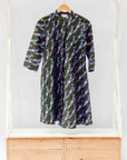 display of a teal, black and purple shirt dress