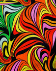 Display of a rainbow swirl design dress