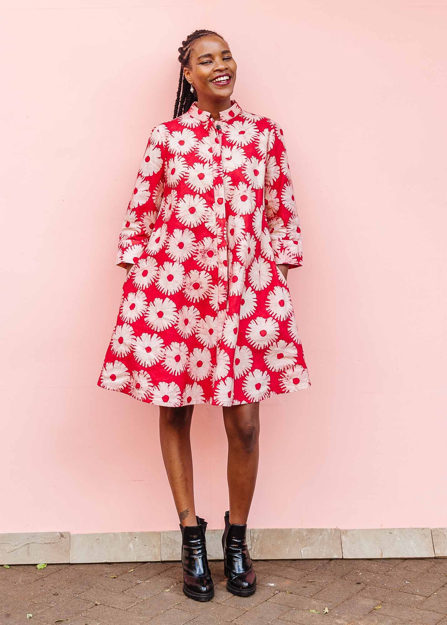 The model is wearing pink and white floral print