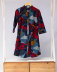 Display of multi-colored geometric print dress