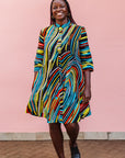 The model is wearing pop art colored geometric print