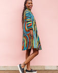 The model is wearing pop art colored geometric print