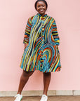 The model is wearing pop art colored geometric print