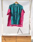 Display of black, pink, sky blue, white, purple print shirt