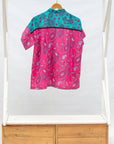 Display of black, pink, sky blue, white, purple print shirt