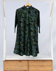 Display of green camo print like dress.