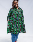 Model wearing green camo print like dress.