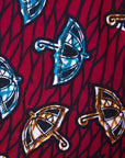 Close up display of red and black dress with umbrella design print