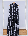 Display of black and white geometric print dress.