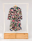 Display of colorful abstract print dress.