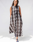 Model wearing black and white geometric print dress.