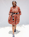Model wearing butterfly print dress.
