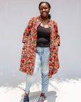 Model wearing butterfly print dress.