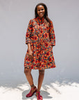 Model wearing butterfly print dress.