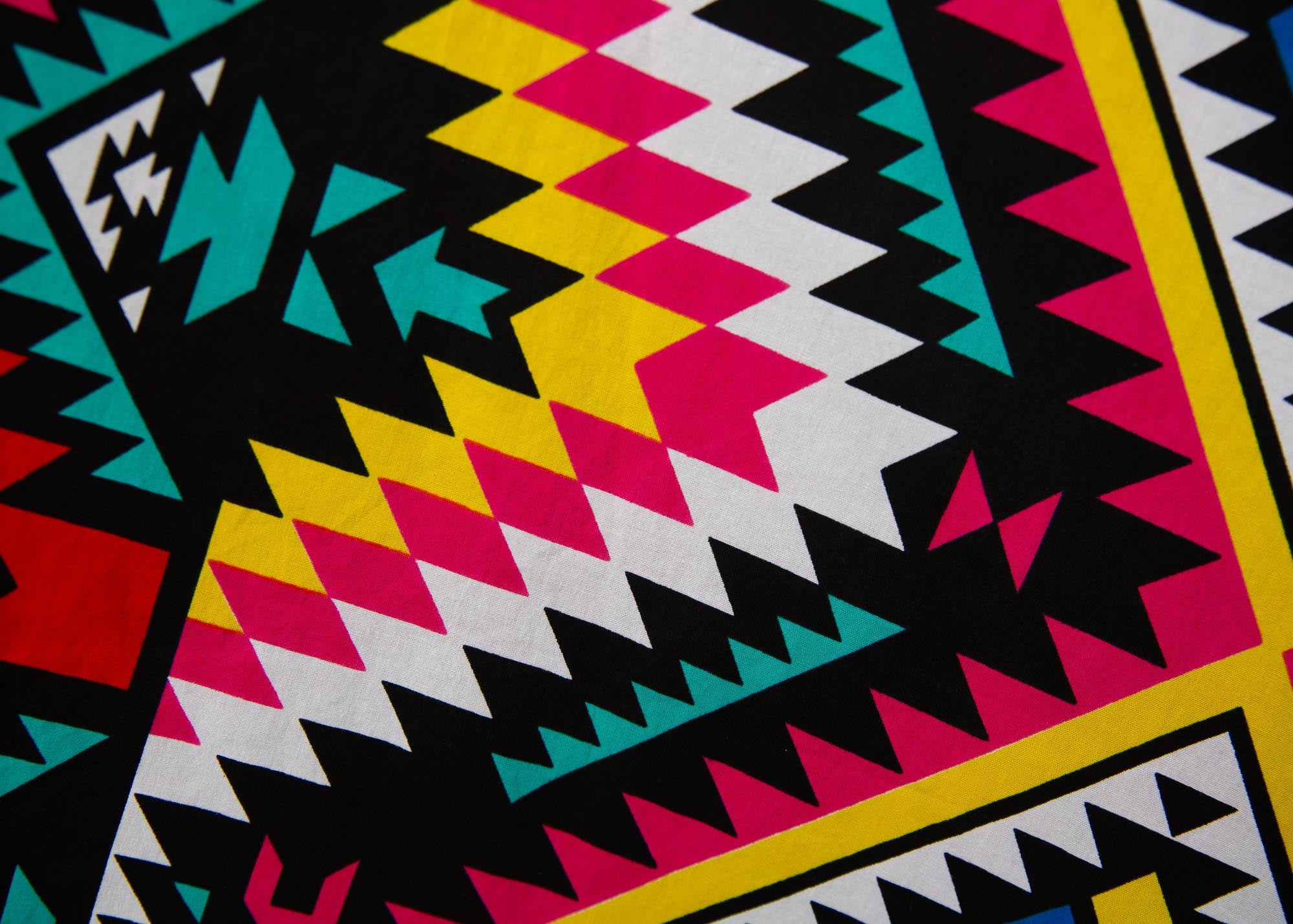 Close up display of multi colored geometric print dress