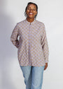 Model wearing linen top with small flower print.
