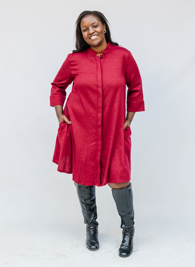 Model wearing burgundy linen dress.