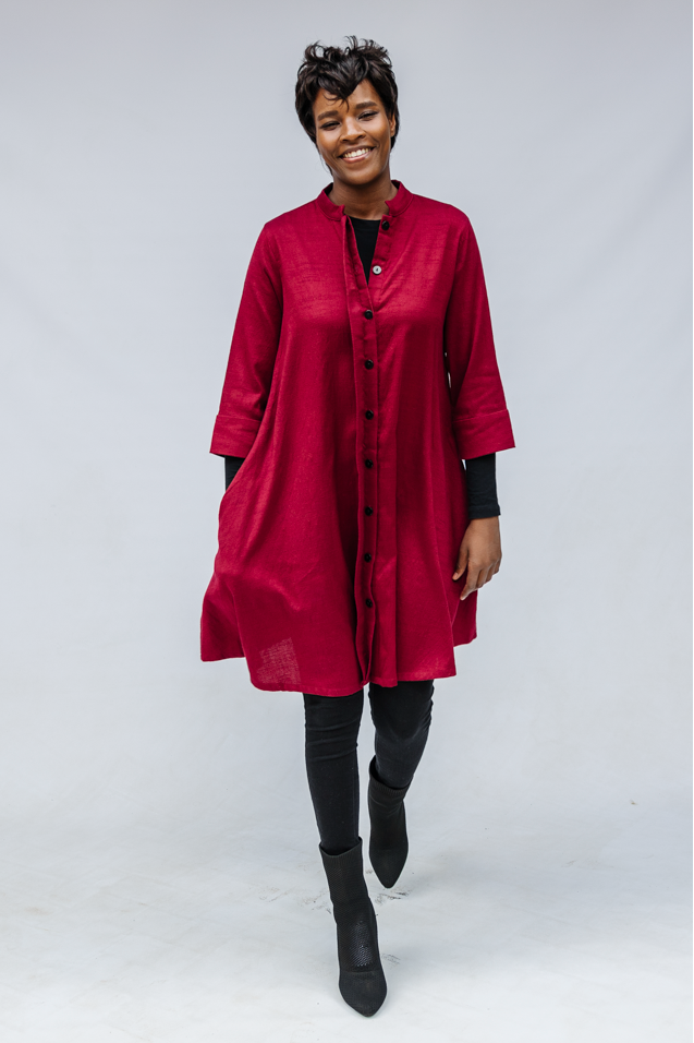 Model wearing burgundy linen dress.