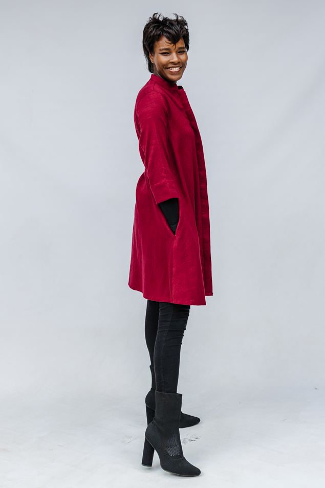 Model wearing burgundy linen dress.