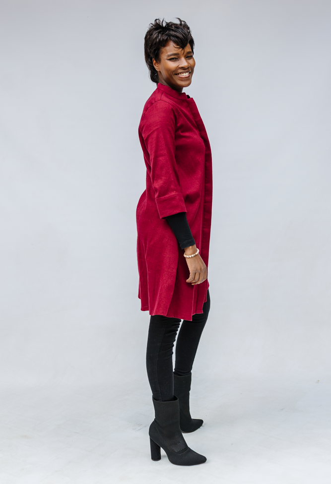 Model wearing burgundy linen dress.
